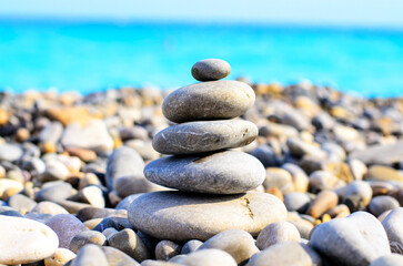 Pile of Smooth Sea Stones Balanced Against Blue Sea and Sky, Nice, France, French Riviera