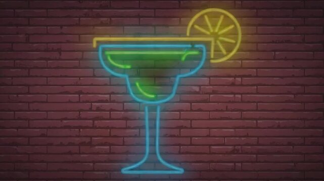 Neon cocktail glass with lime slice glowing against a brick wall, perfect for nightlife themes