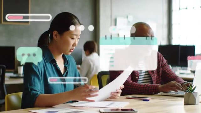 Teamwork Harmony in Tech-Infused Workspace: Capturing the essence of teamwork in a modern office environment, two colleagues are engrossed in a collaborative project.