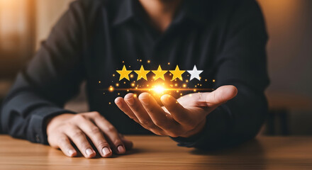 A person holds their hand out, displaying four gold stars and one white star, representing a customer satisfaction rating.