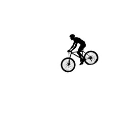 Fototapeta premium Silhouette of a mountain biker performing a stunt.