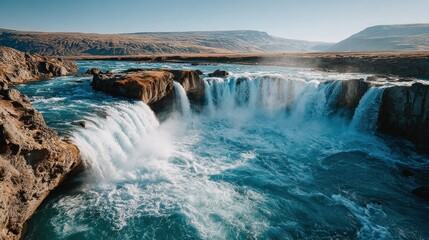 Iceland waterfall cascading into a turquoise river
