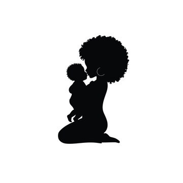 Mother holding baby with love heart silhouette