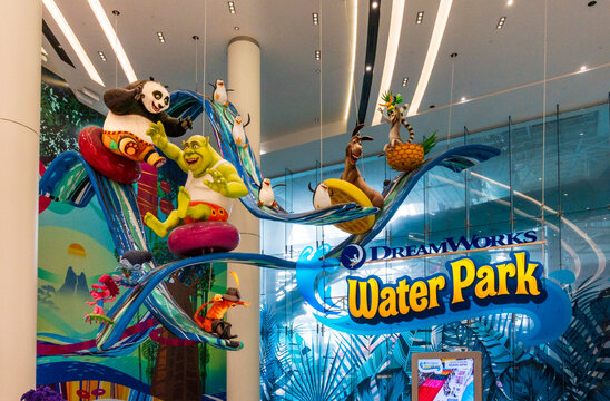 East Rutherford, NJ - US - Jul 26, 2025 Colorful DreamWorks characters like Shrek, Po, Donkey, and King Julien ride water slides above the entrance of DreamWorks Water Park at American Dream mall