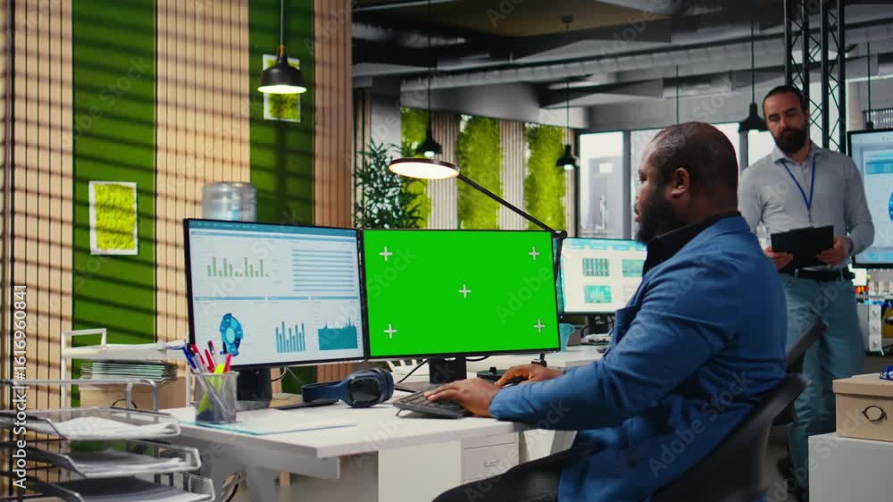 Aufkleber african american man engaged in business planning with a green screen, does report writing to ensure