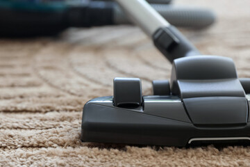 One vacuum cleaner on floor indoors, closeup