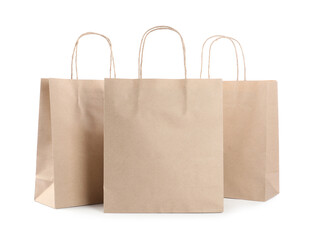 Three kraft paper bags isolated on white