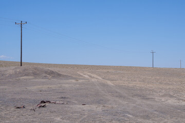 Remote, desolate Utah desert scenery with power pole lines, near Cisco UT