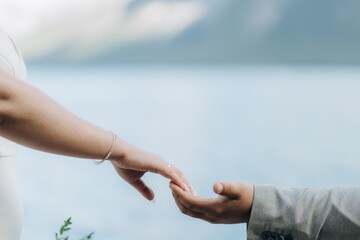 Man and woman holding each other hands