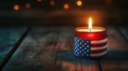 a lit candle with an American flag ribbon wrapped around it, placed on a dark wooden table with soft light and a somber background