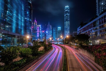 Fototapeta premium Night cityscape with light trails on highway