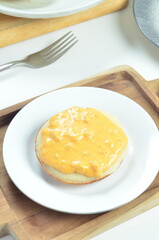 Serabi with cheese pasta topping, a traditional Indonesian snack.