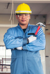 Vertical Horizon Portrait Civil Construction engineer man holding blueprint file folder on site...