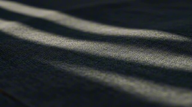 Striped texture Dark material with lighter horizontal stripes from light falling on it