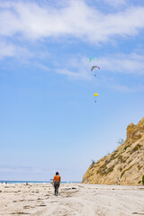 People paragliding over Black Beach La Jolla California 2025 