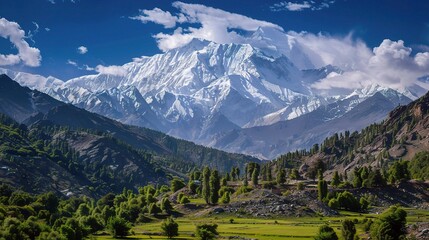 Majestic view of Nanga Parbat, the ninth-highest mountain in the world, featuring snow-capped peaks, steep rocky cliffs, glaciers, and swirling clouds in the Himalayas