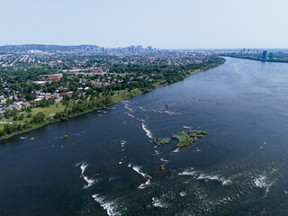 Aerial view of Lachine Rapids and residential area near Saint Lawrence River in Montreal, Canada. g.
