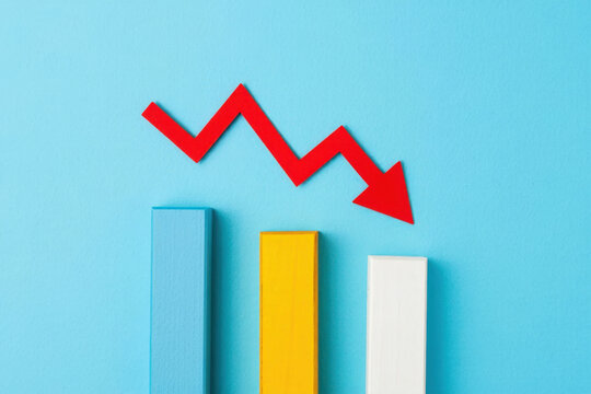 Economic Downturn A Red Arrow Plunging Downward Across Colorful Bar Graphs Signifying Financial Loss Recession and Market Decline in a Challenging Economy