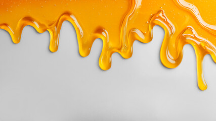 liquid honey dripping on white background