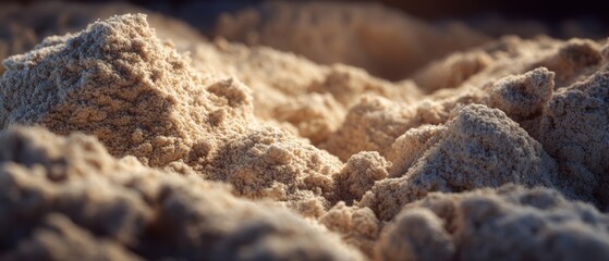 Close-up view of textured sand with natural lighting and soft shadows.