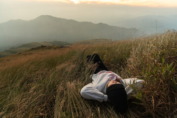 Lifestyle traveler happy feeling good relax and freedom facing in the sunrise morning. Travel Concept