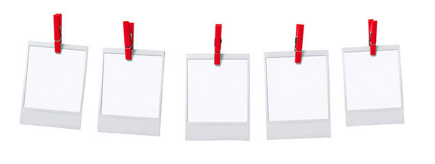 Five blank instant photos with red clips