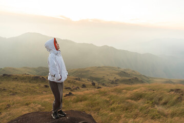 Lifestyle traveler happy feeling good relax and freedom facing in the sunrise morning. Travel Concept