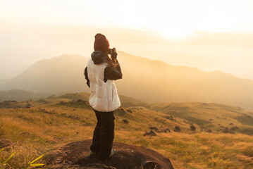 Lifestyle traveler happy feeling good relax and freedom facing in the sunrise morning. Travel Concept