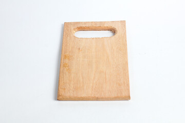wooden cutting board with a handle cut out of one end, isolated on a white background.