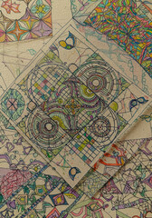 A collection of colorful, hand-drawn patterned tiles creates a mosaic, with one prominent diamond-shaped tile at the center showcasing intricate designs
