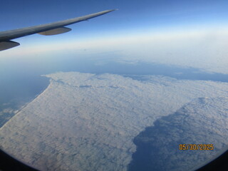View from the plane of clouds