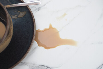 Coffee spilled on marble counter after breakfast