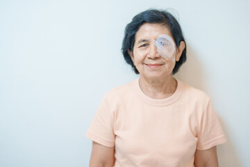 Elderly Woman with eye protective shield after eye surgery. Eye disease, Cataract,  Glaucoma, Age Related Macular Degeneration, Diabetic Retinopathy, Vitreous, Lasik, World Glaucoma day and health