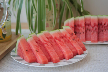 Freshly sliced watermelon arranged on a plate for summer fun