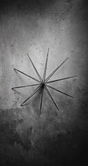 Abstract metal design on textured wall