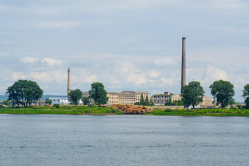 Obraz premium View of the North Korean cityscape of Sinuiju from a Yalu River cruise ship, Dandong, Liaoning, China