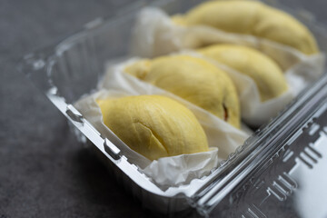 Durian packed in clear plastic box. Selective focus