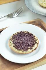 Serabi pancake with chocolate sprinkles topping, a traditional Indonesian snack.
