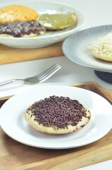 Serabi pancake with chocolate sprinkles topping, a traditional Indonesian snack.