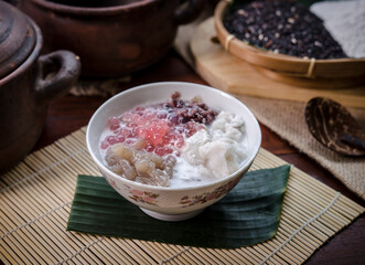 Bubur srintil, or mix porridge – a colorful traditional Indonesian dessert made from a mix of candil (glutinous rice balls), green and white rice flour porridge, black sticky rice