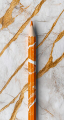 Digital image of an orange and white marble pencil on a glossy marble tabletop, featuring subtle gold stripes in a clean, minimal design aesthetic.