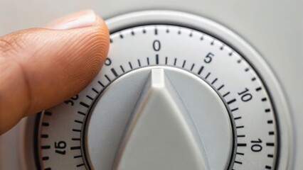 A close-up of a finger adjusting a timer dial, indicating precision and control in time management.