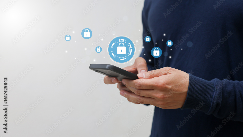 Wall mural closeup young man hand hold smartphone to check about safety about account system on internet by usi