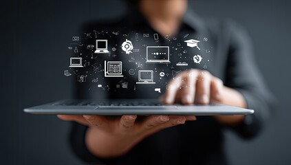 Hands holding tablet with digital education icons