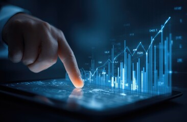 Businessman interacting with a digital tablet displaying financial data