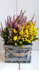 Colorful spring flowers in a gray basket