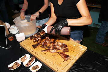 CHef prepares ribs outdoors