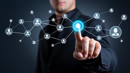 Man touching glowing digital network with people icons business technology