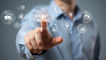 Person pointing at grant funding digital interface with icons business technology