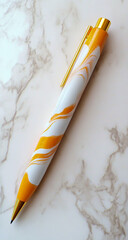 High-resolution closeup of a stylized orange and white marble pen, with a golden shiny tip, resting on a polished marble desk surface,